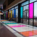 Mokpo Natural History Museum, featuring colorful glass windows and a well-lit exhibition space.