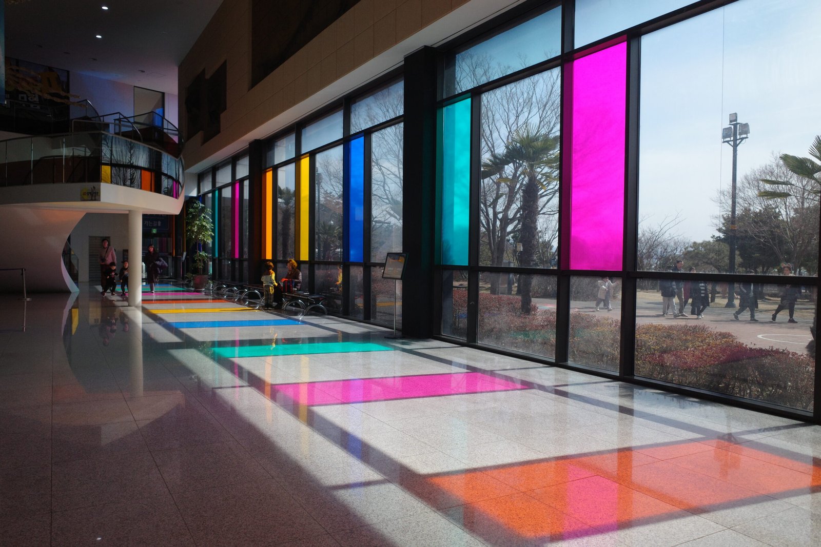 Mokpo Natural History Museum, featuring colorful glass windows and a well-lit exhibition space.